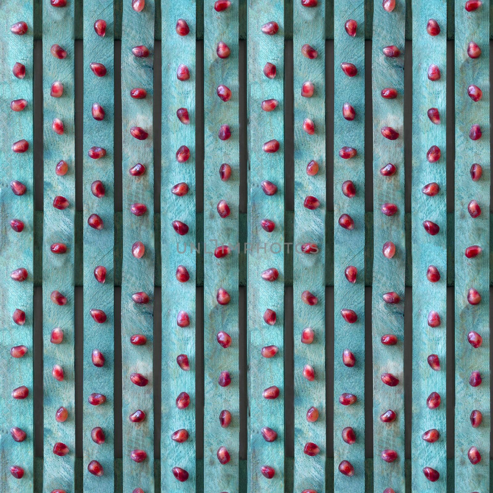 Seamless background. Red pomegranate seeds on turquoise board. 4 fragments  by Laguna781