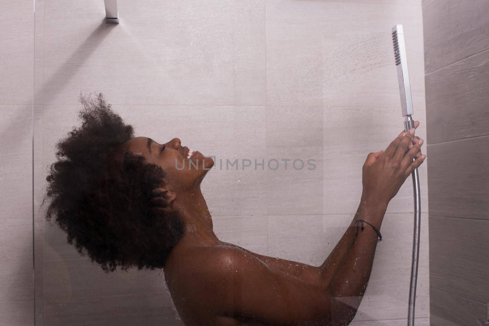 African American woman in the shower by dotshock