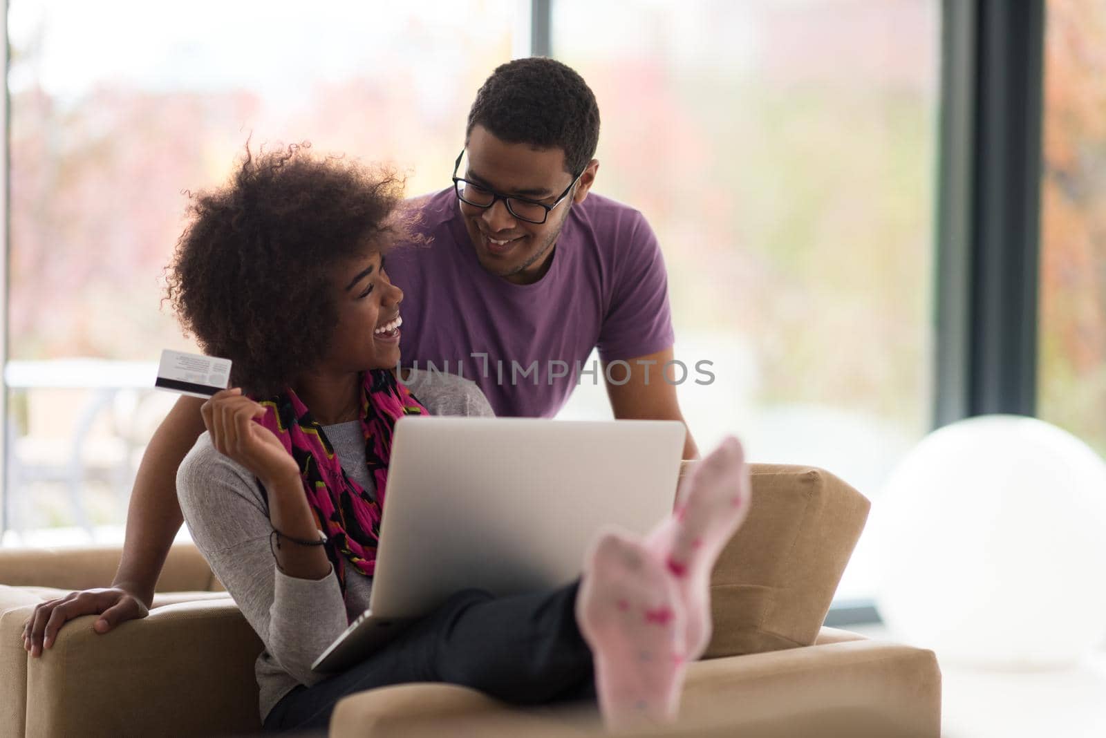 african american couple shopping online by dotshock