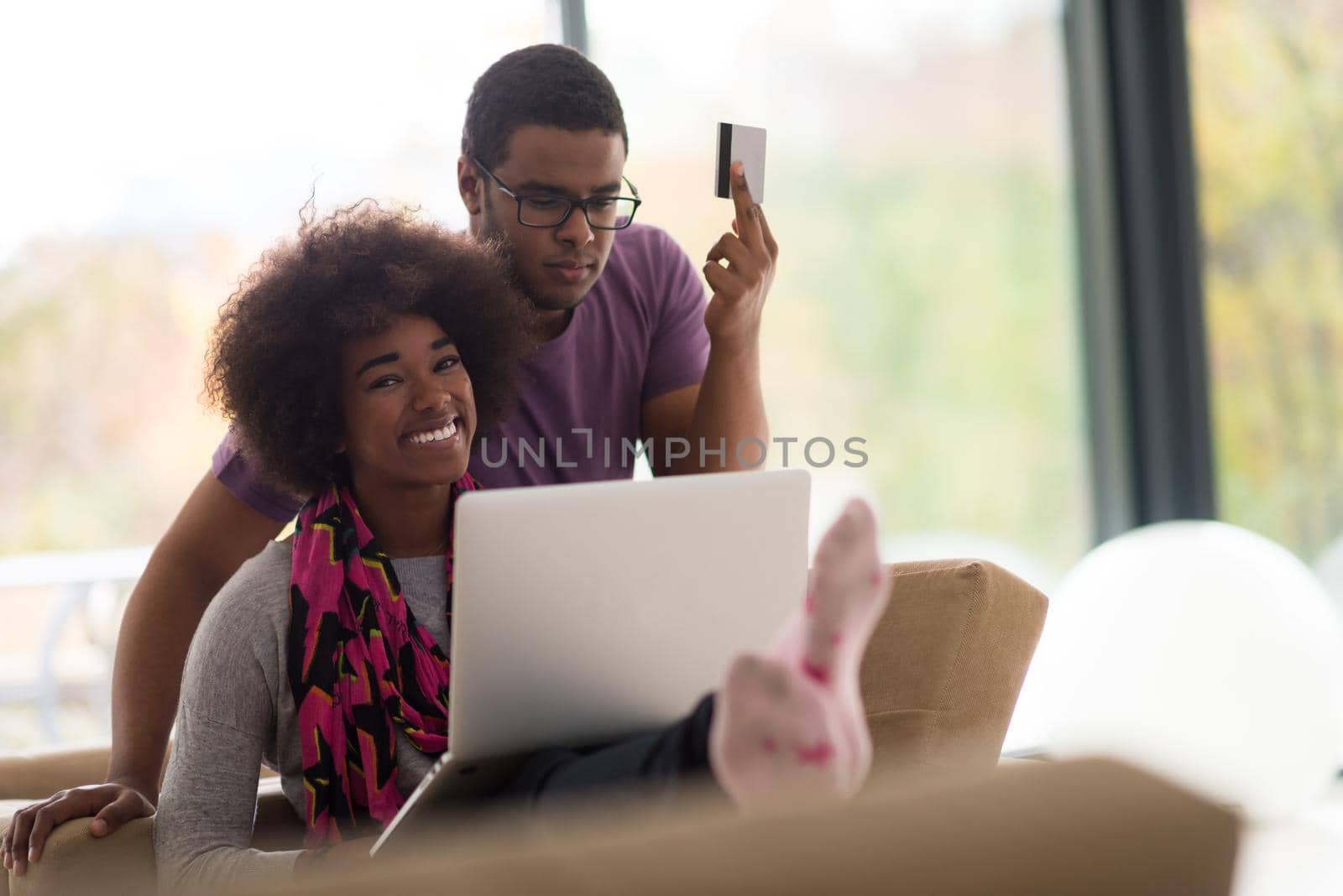 african american couple shopping online by dotshock