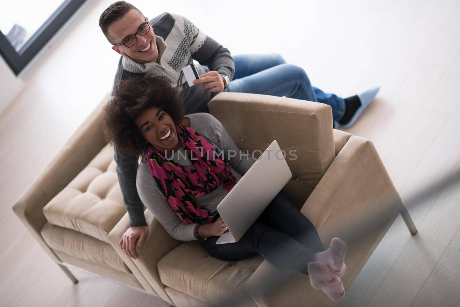 multiethnic couple shopping online by dotshock