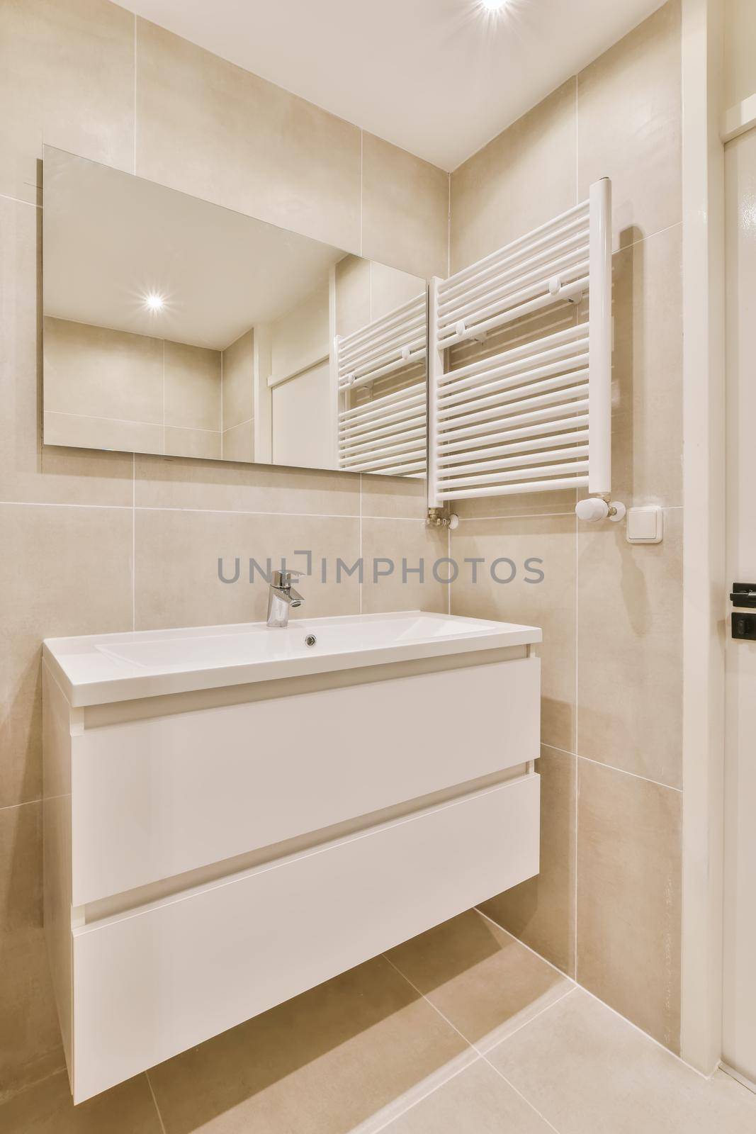 Beige bathroom design in a luxury apartment