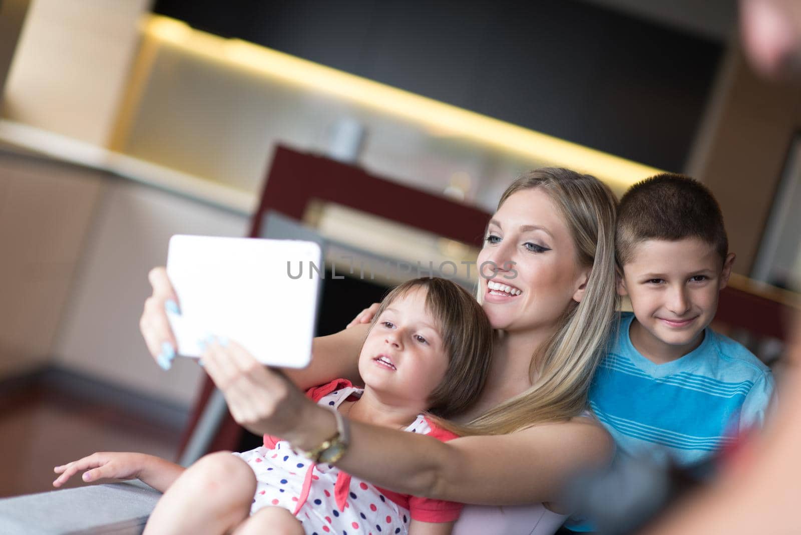 Young Family Using A Tablet To Make Future Plans by dotshock