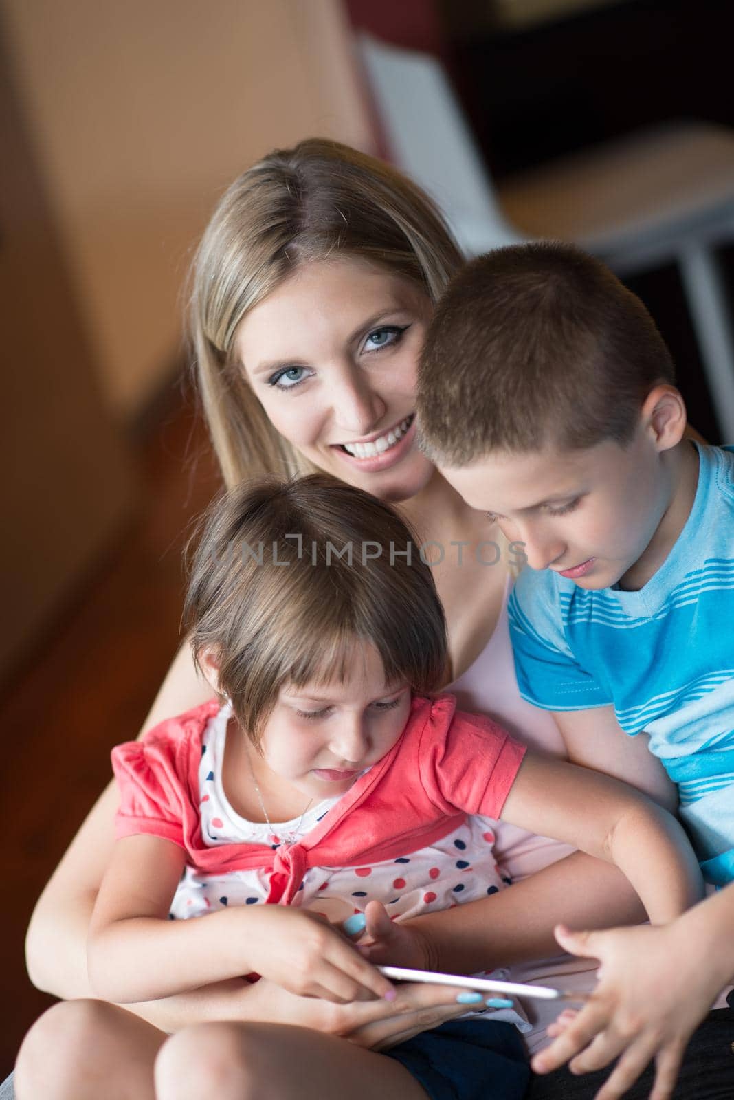 Young Family Using A Tablet To Make Future Plans by dotshock