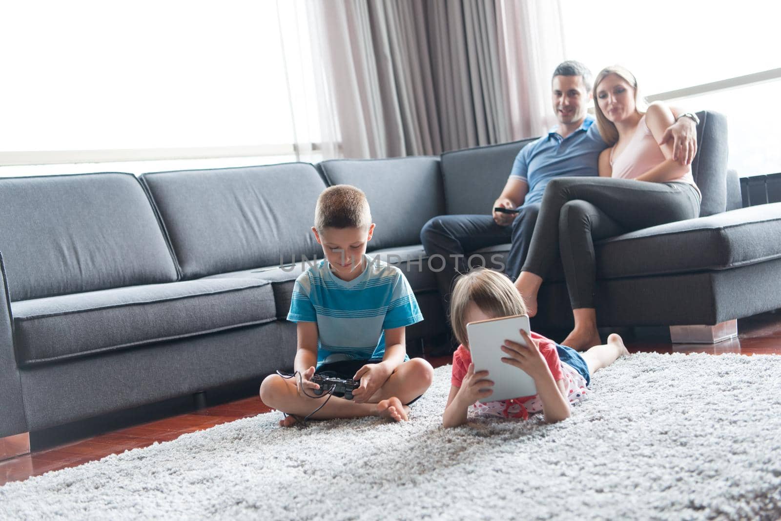 Happy Young Family Playing Together at home