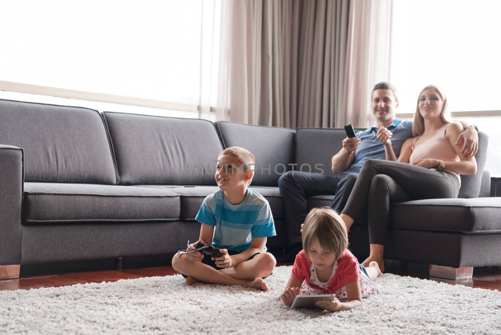 Happy Young Family Playing Together at home