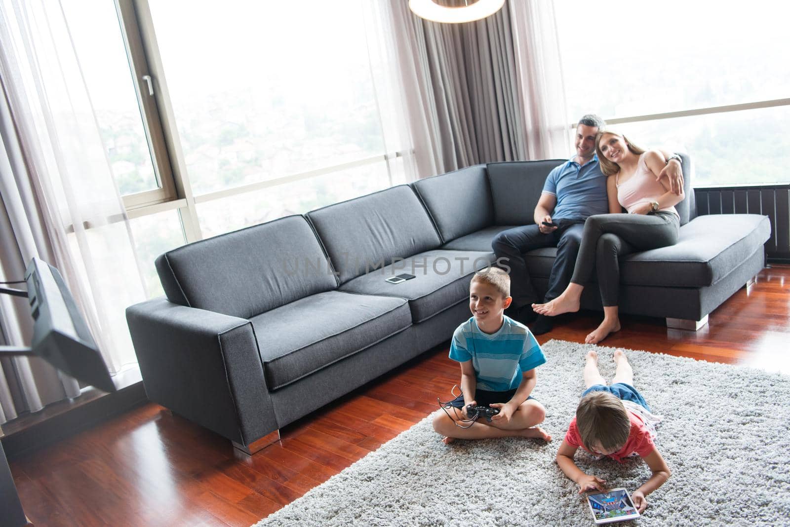 Happy Young Family Playing Together at home