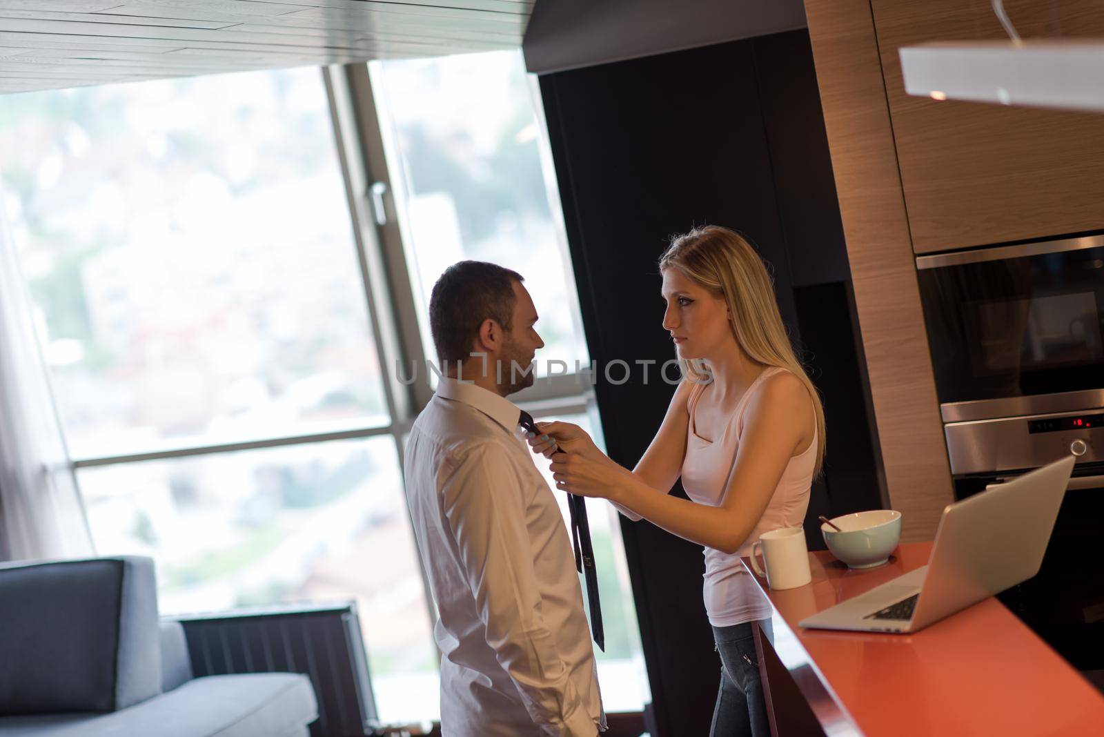 A young couple is preparing for a job and using a laptop by dotshock