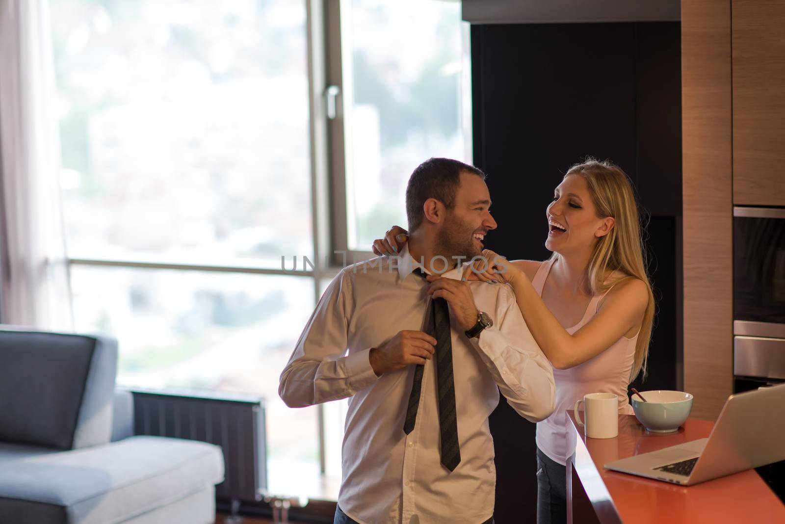 A young couple is preparing for a job and using a laptop by dotshock