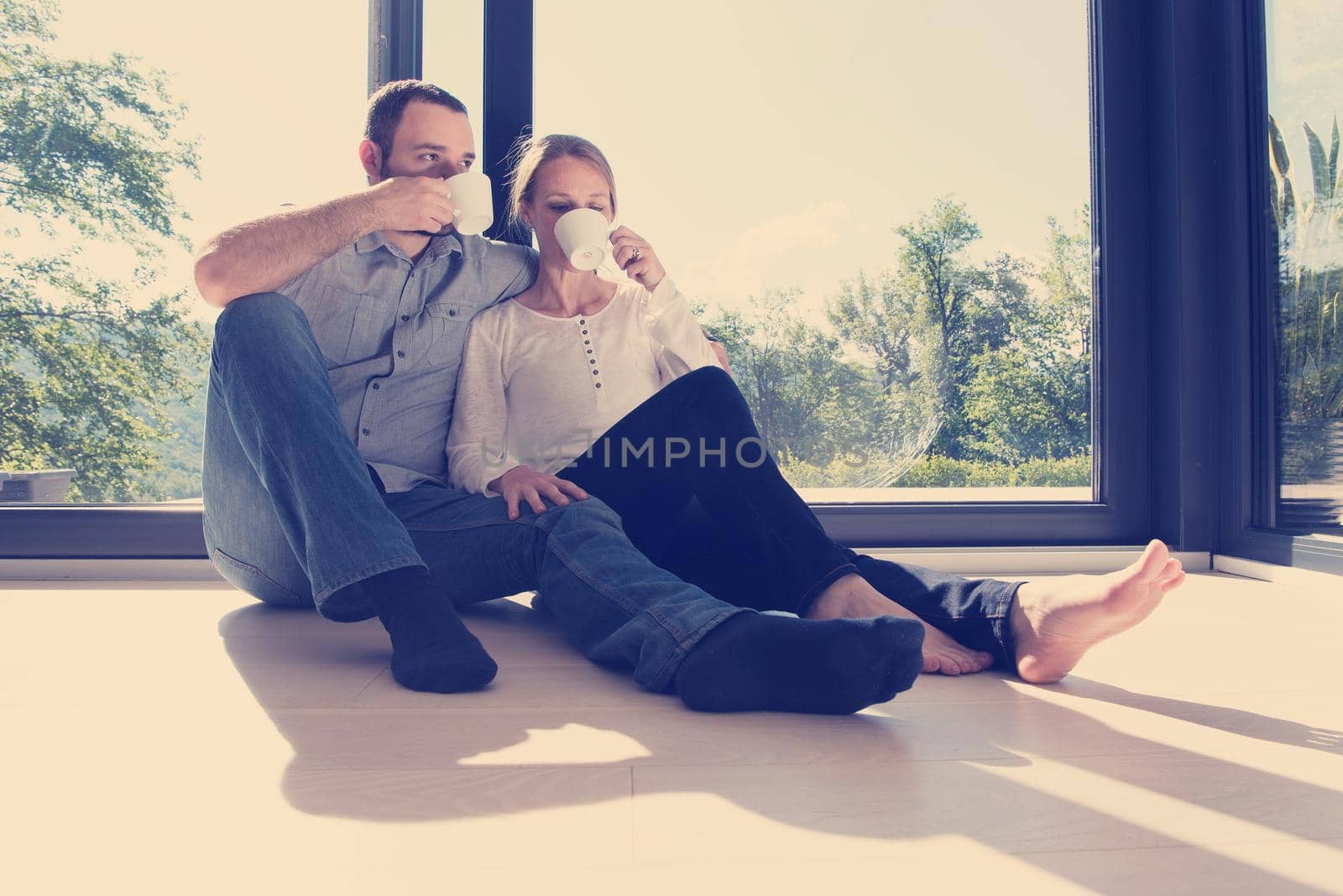 romantic couple enjoying morning coffee by dotshock