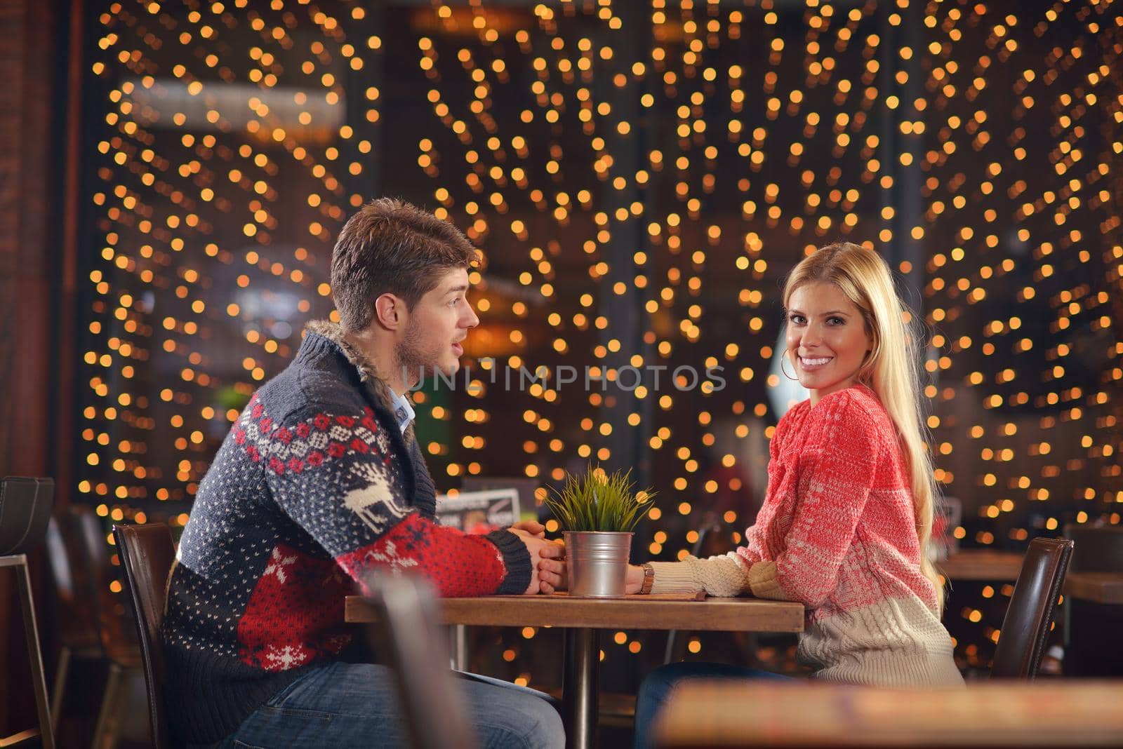 romantic evening date in restaurant  happy young couple with wine glass tea and cake