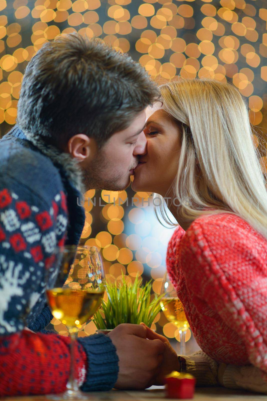 romantic evening date in restaurant  happy young couple with wine glass tea and cake