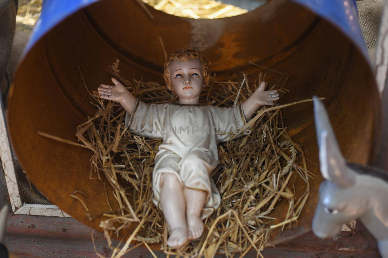 Baby Jesus laying in a cradle
