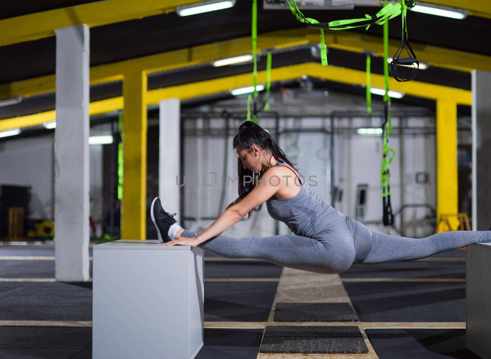 woman working out gymnastic exercise on fit boxes by dotshock