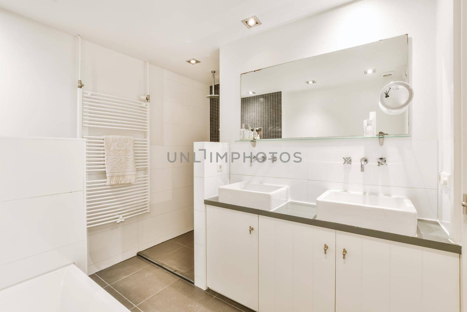 Elegant bathroom with two washbasins and a large mirror