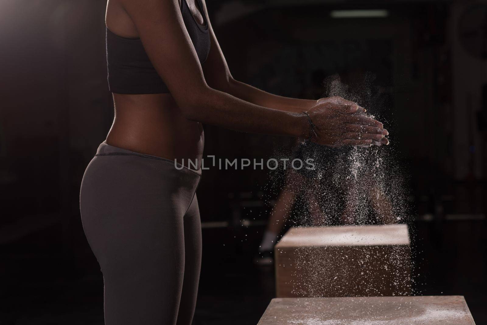 black woman preparing for climbing workout by dotshock
