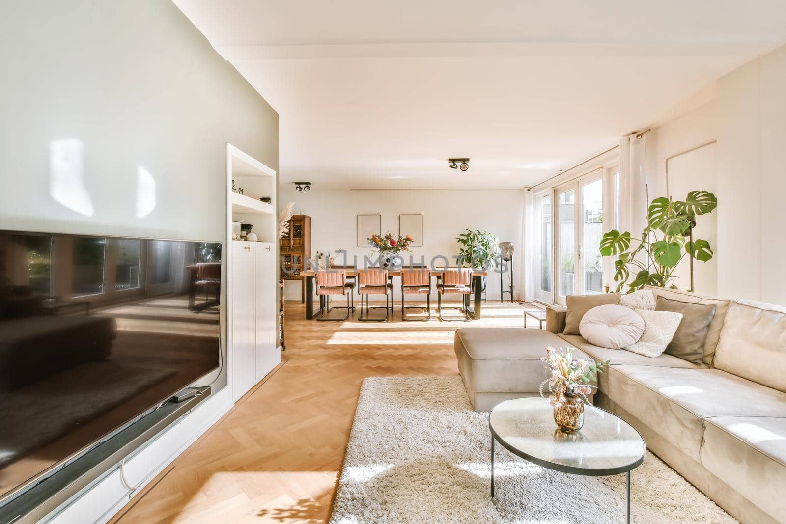 Living room with a large brown sofa and a small round coffee table