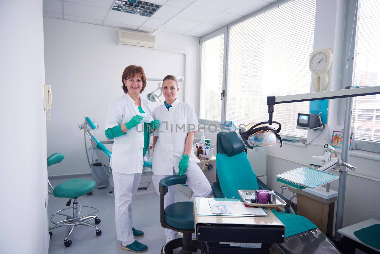 portrait of a dentist  smiling at the camera