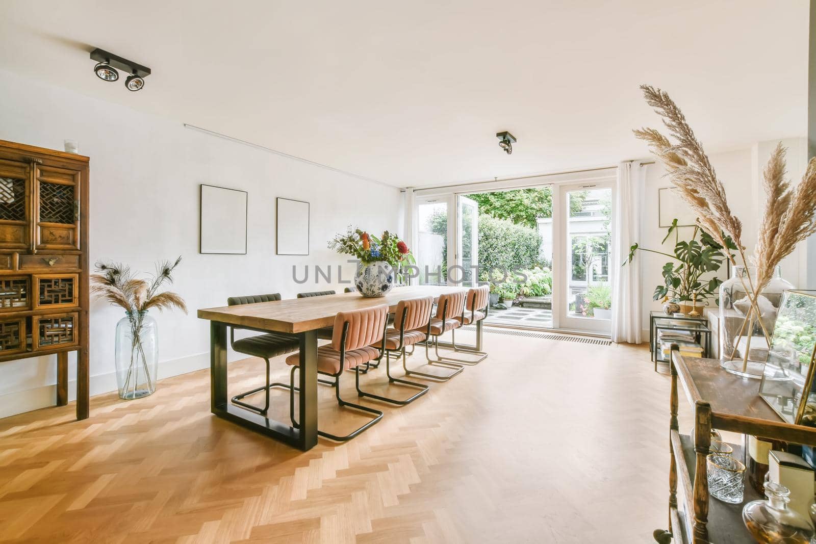 Spacious dining area for eight with comfortable and modern chairs and table