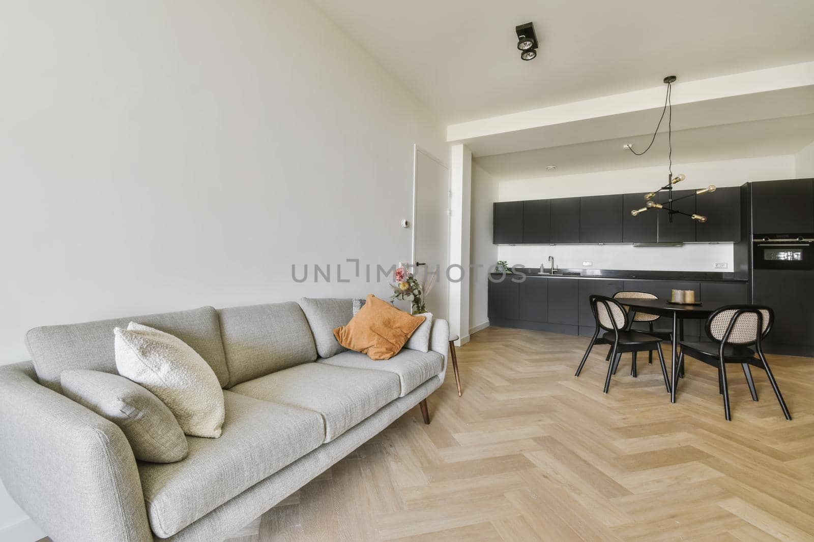 Gray comfortable and soft sofa with pillows in the living area