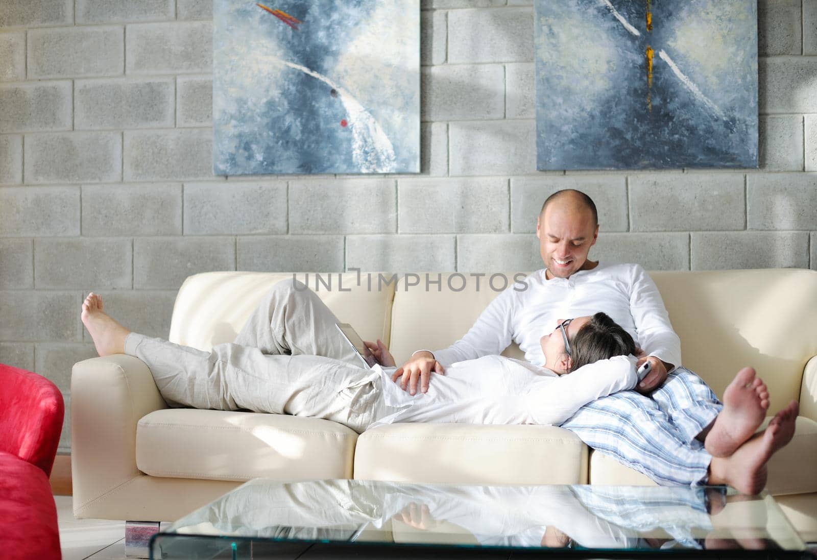 happy young  Couple Using Digital Tablet computer At Home