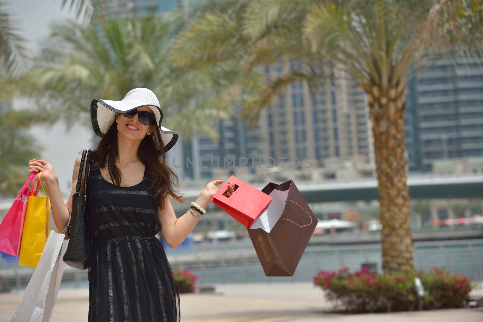 beautiful woman goes in shopping in the city