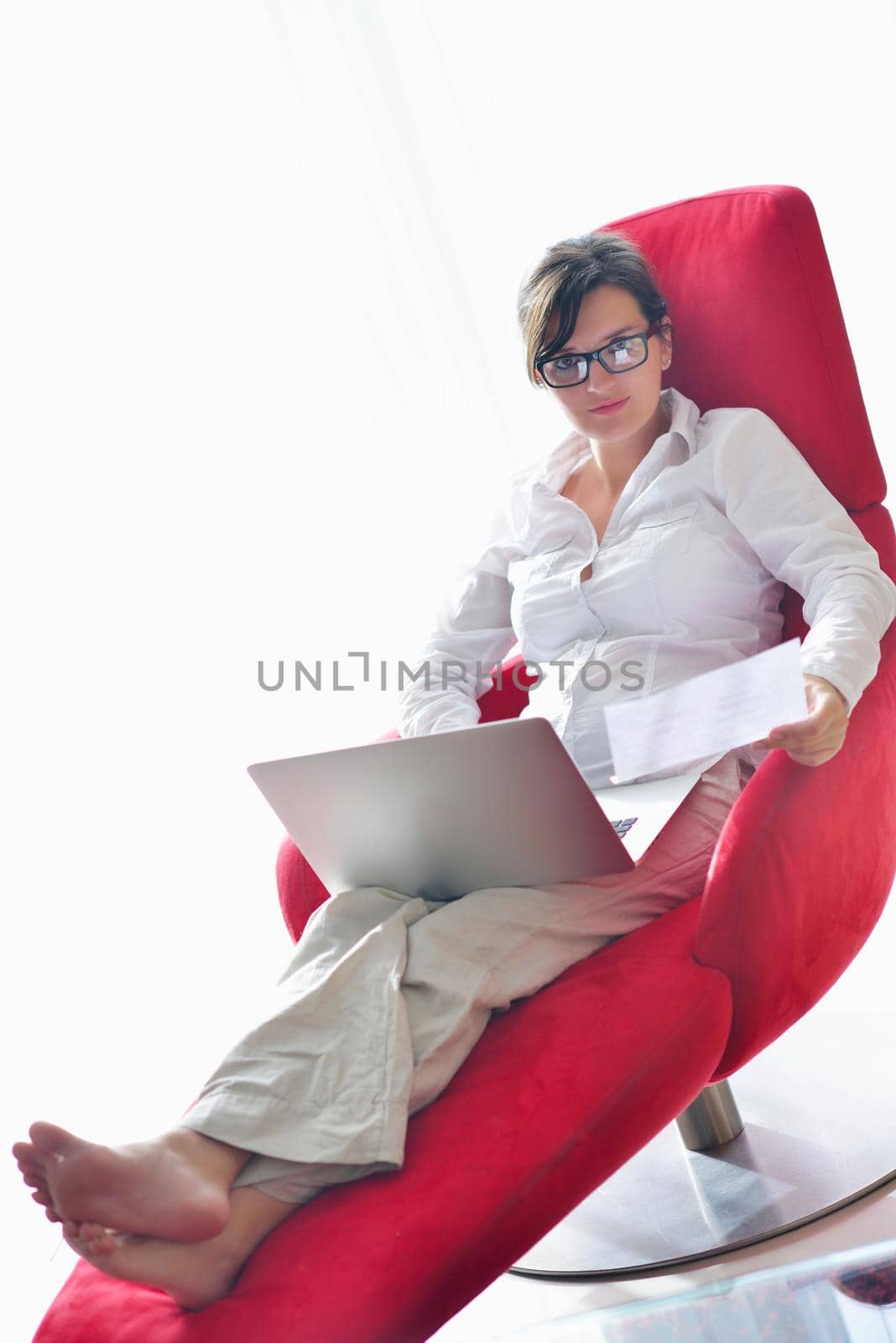 young beautiful woman using a laptop computer at home