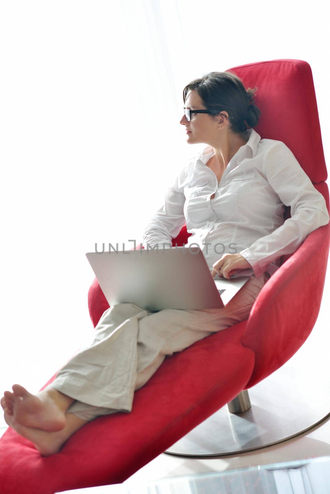 woman working on laptop computer and relax at modern home