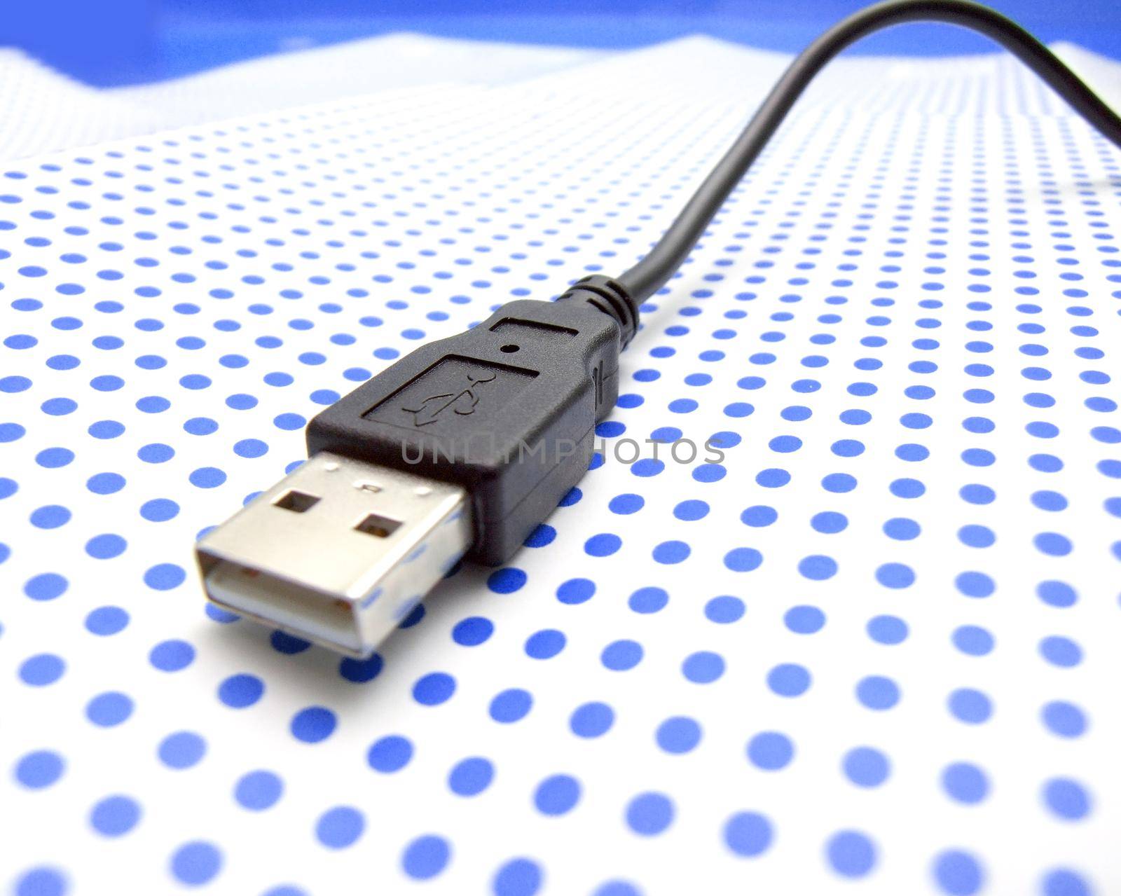 usb cable on dotted background by dotshock