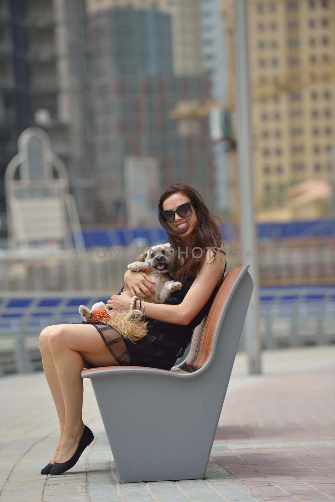happy young woman with puppy have fun by dotshock