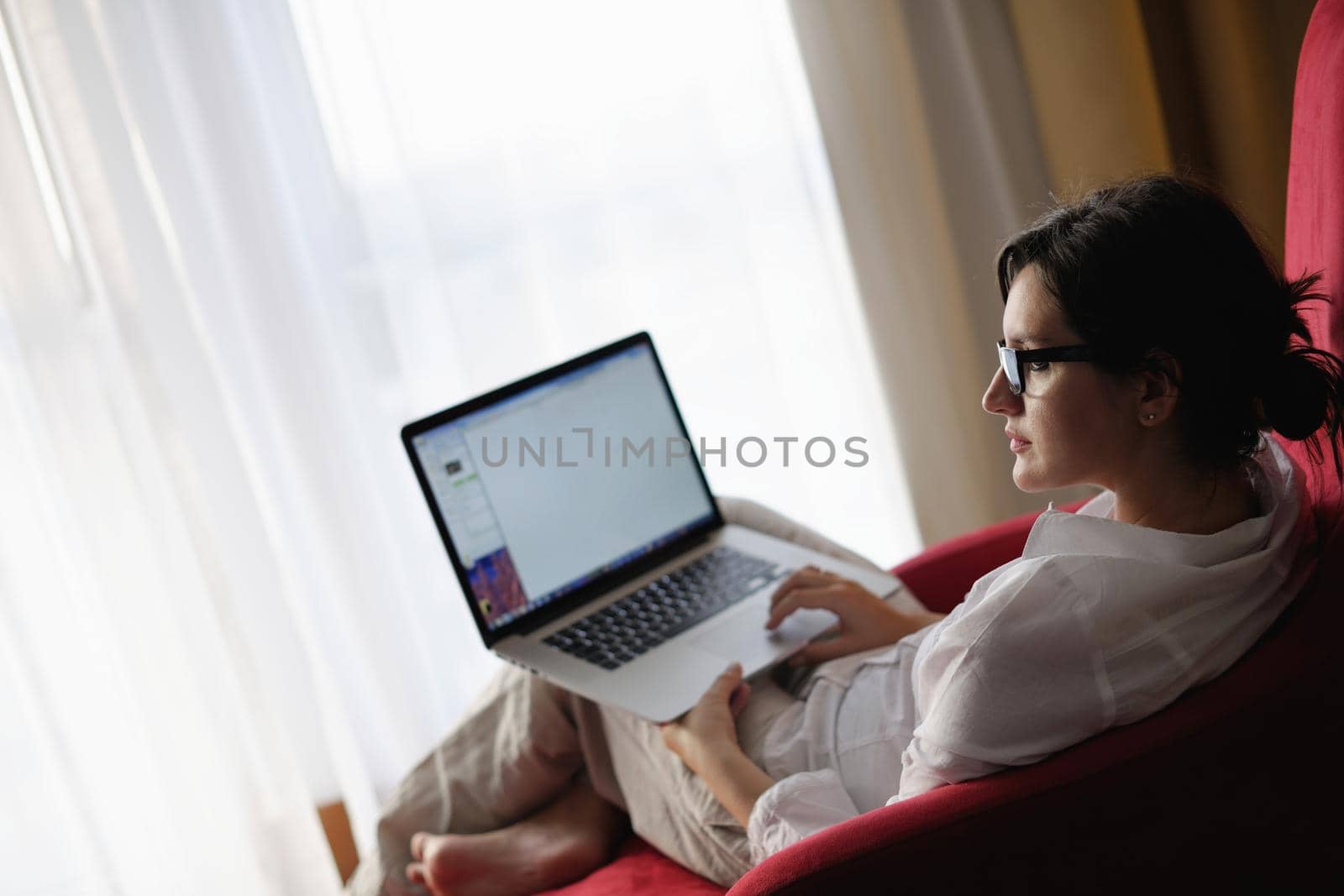 young beautiful woman using a laptop computer at home