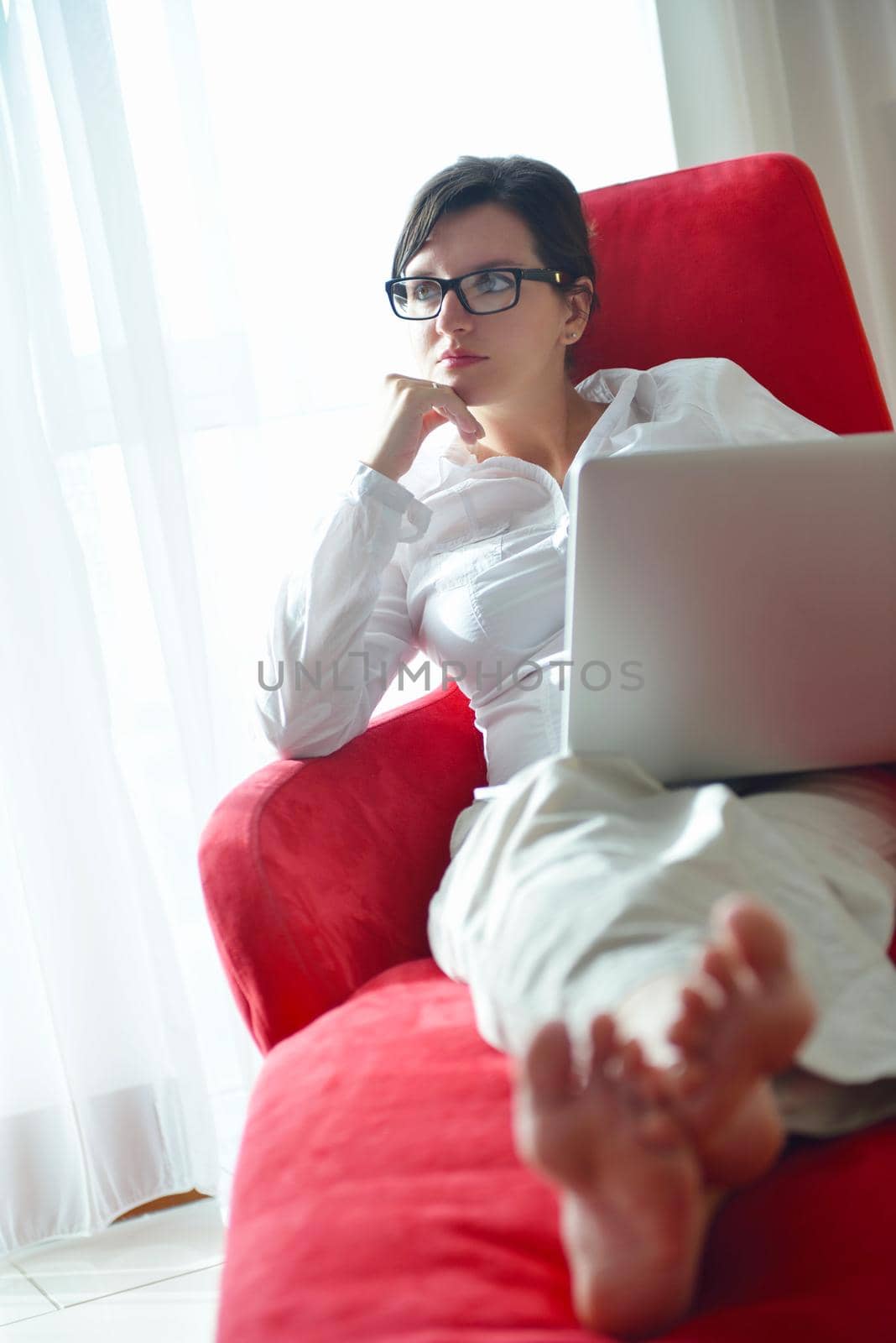 young beautiful woman using a laptop computer at home