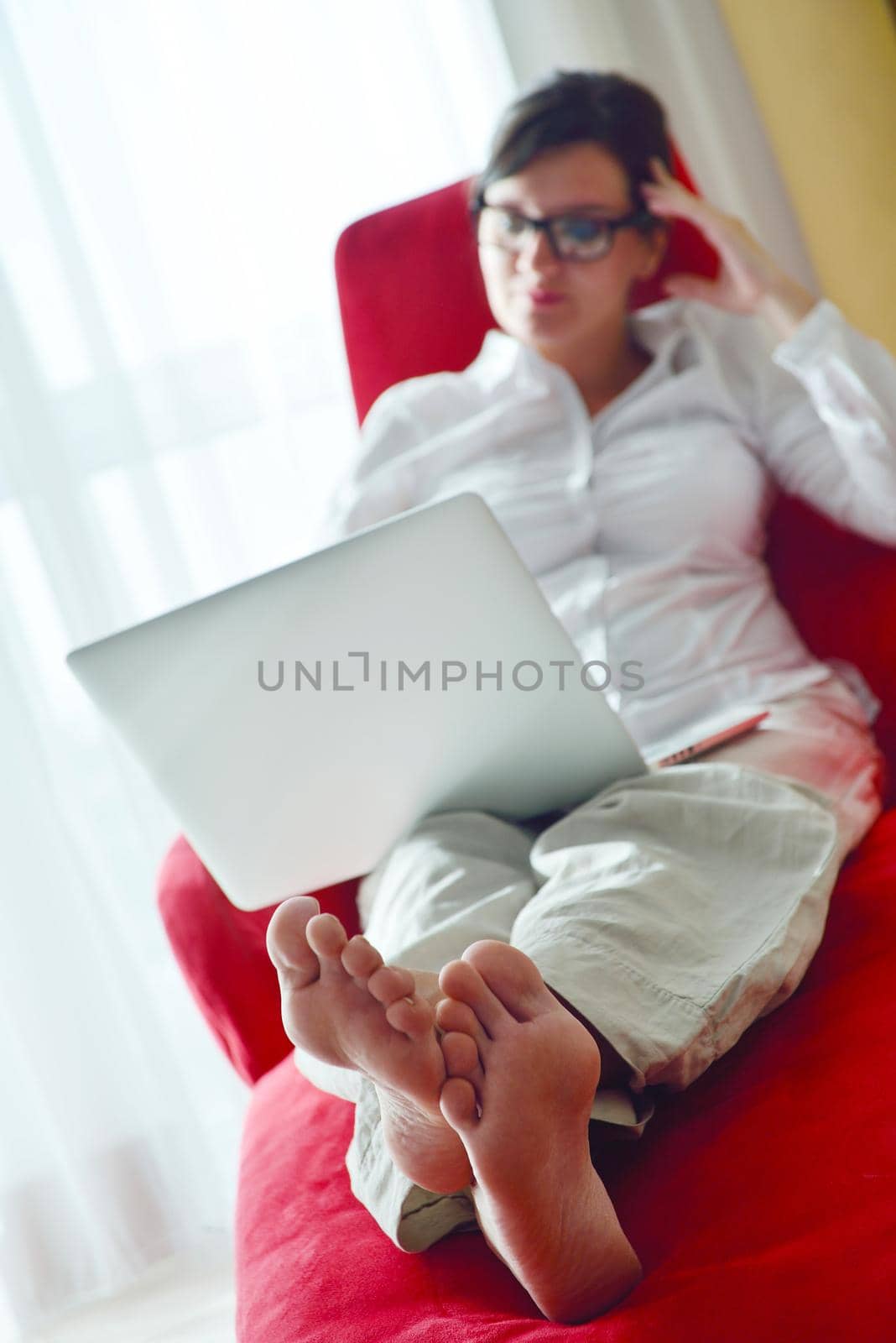 young beautiful woman using a laptop computer at home