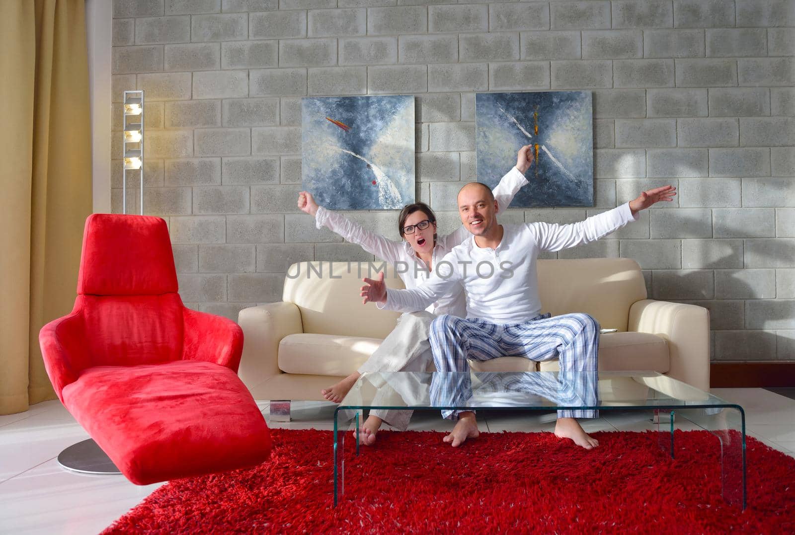 happy young couple relax at modern home living room indoor