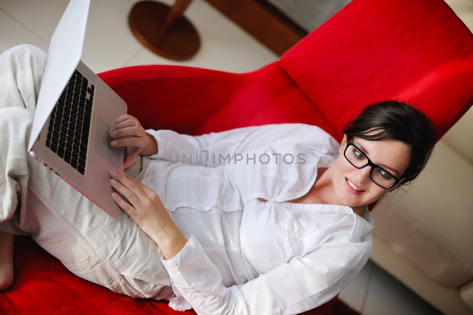 adult, beautiful, beauty, brunette, casual, caucasian, computer, couch, face, female, fun, girl, happy, home, house, indoor, indoors, interior, internet, keyboard, laptop, leisure, life, lifestyle, living, living room, modern, notebook, one, online, people, person, portrait, pretty, relax, room, smile, smiling, sofa, student, technology, typing, using, web, white, window, wireless, woman, work, young