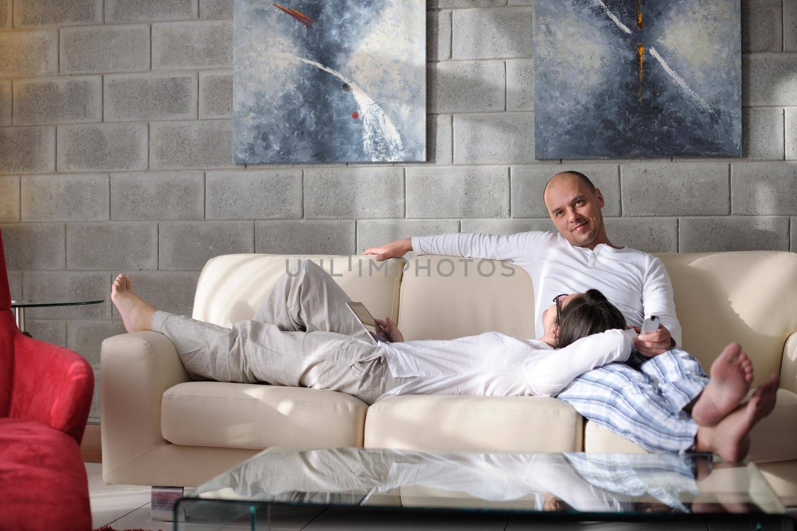 happy young couple relax at modern home living room indoor