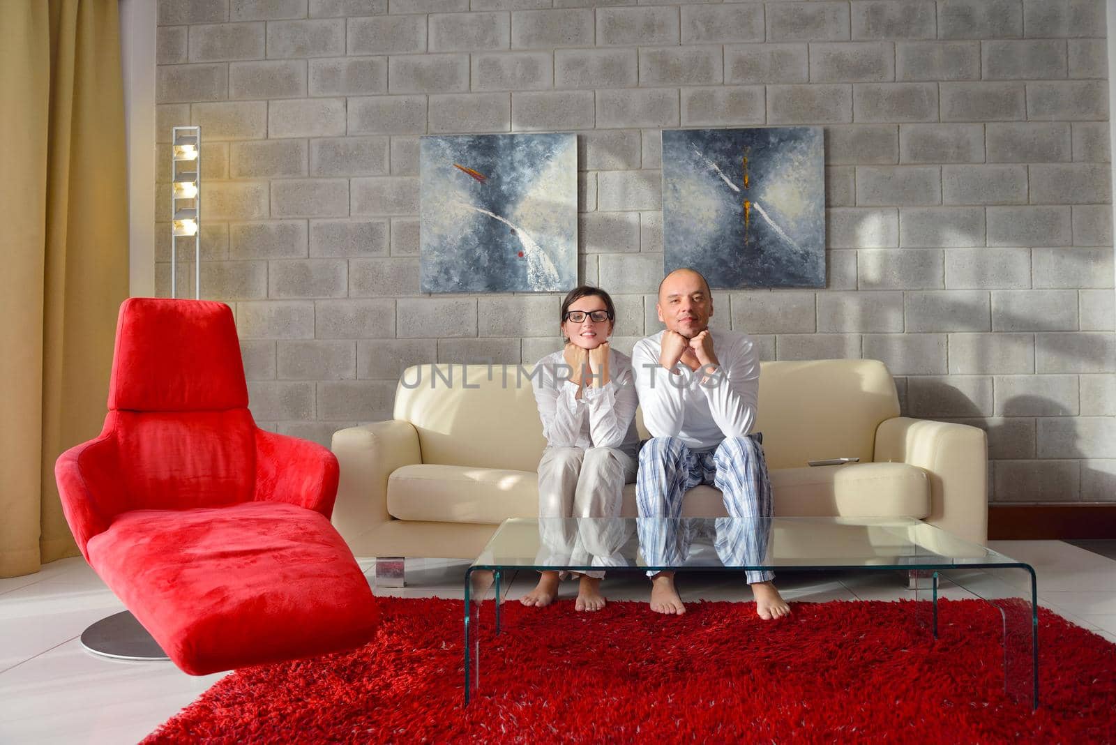 happy young couple relax at modern home living room indoor