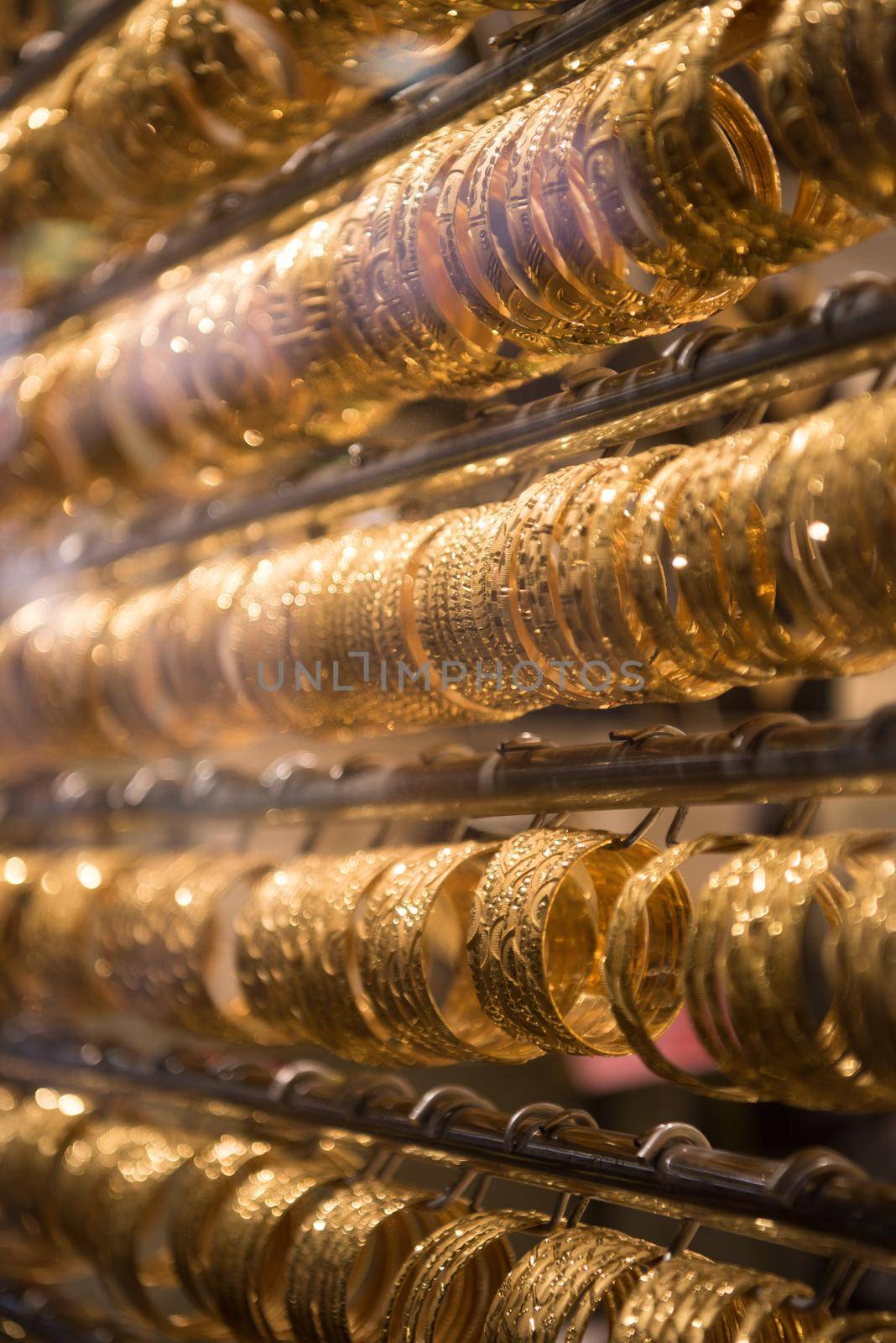 gold jewelry in the shop window by dotshock