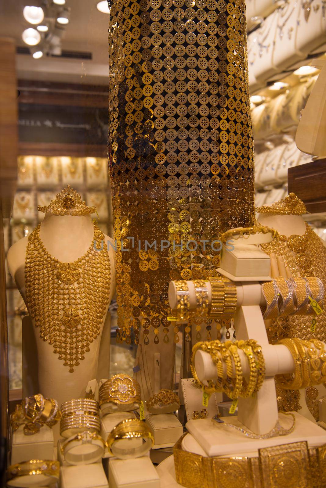 gold jewelry in the shop window by dotshock