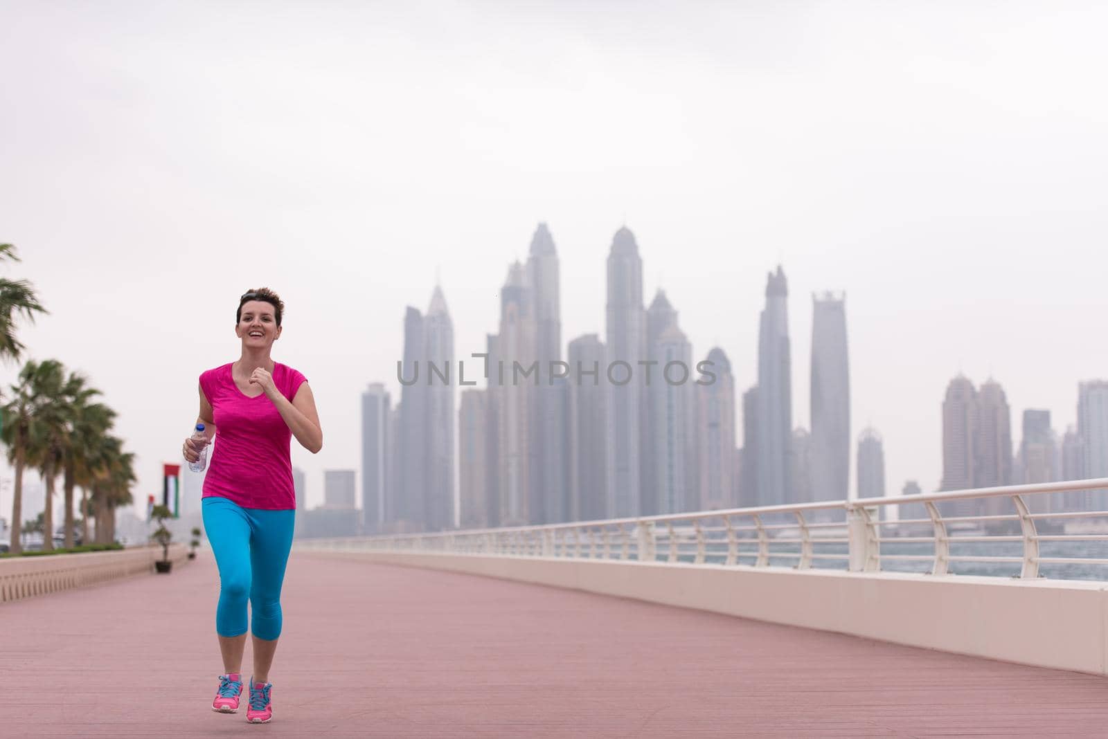 woman running on the promenade by dotshock