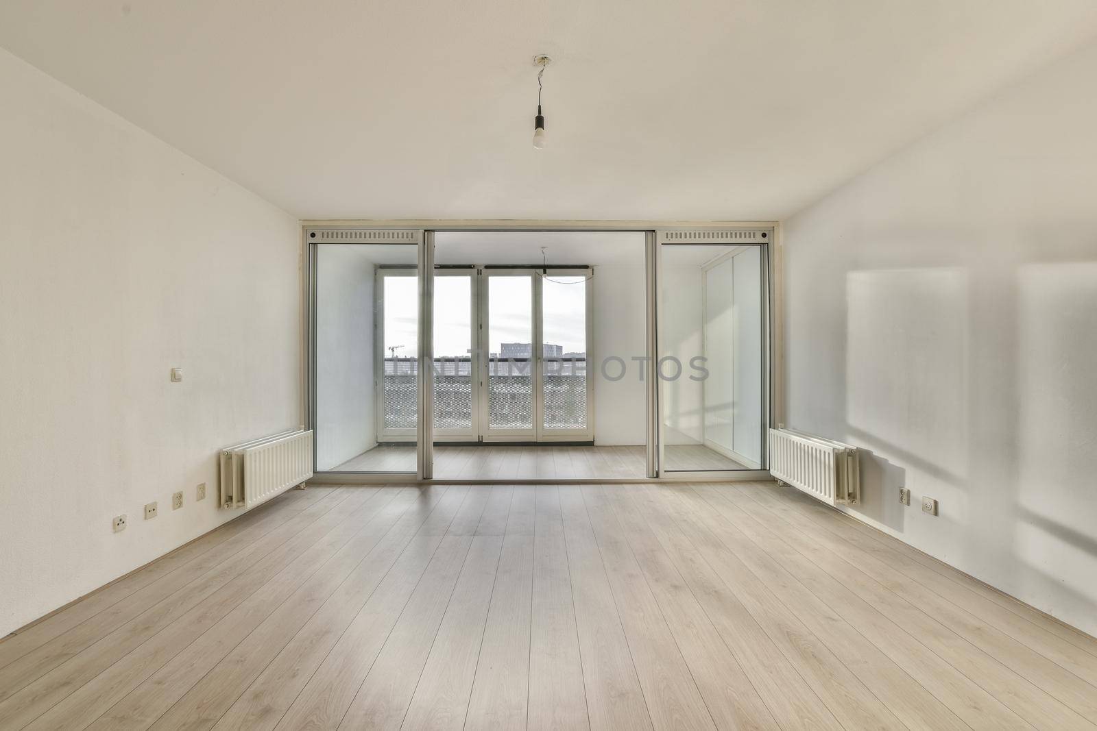 A bright room with large windows on the entire wall