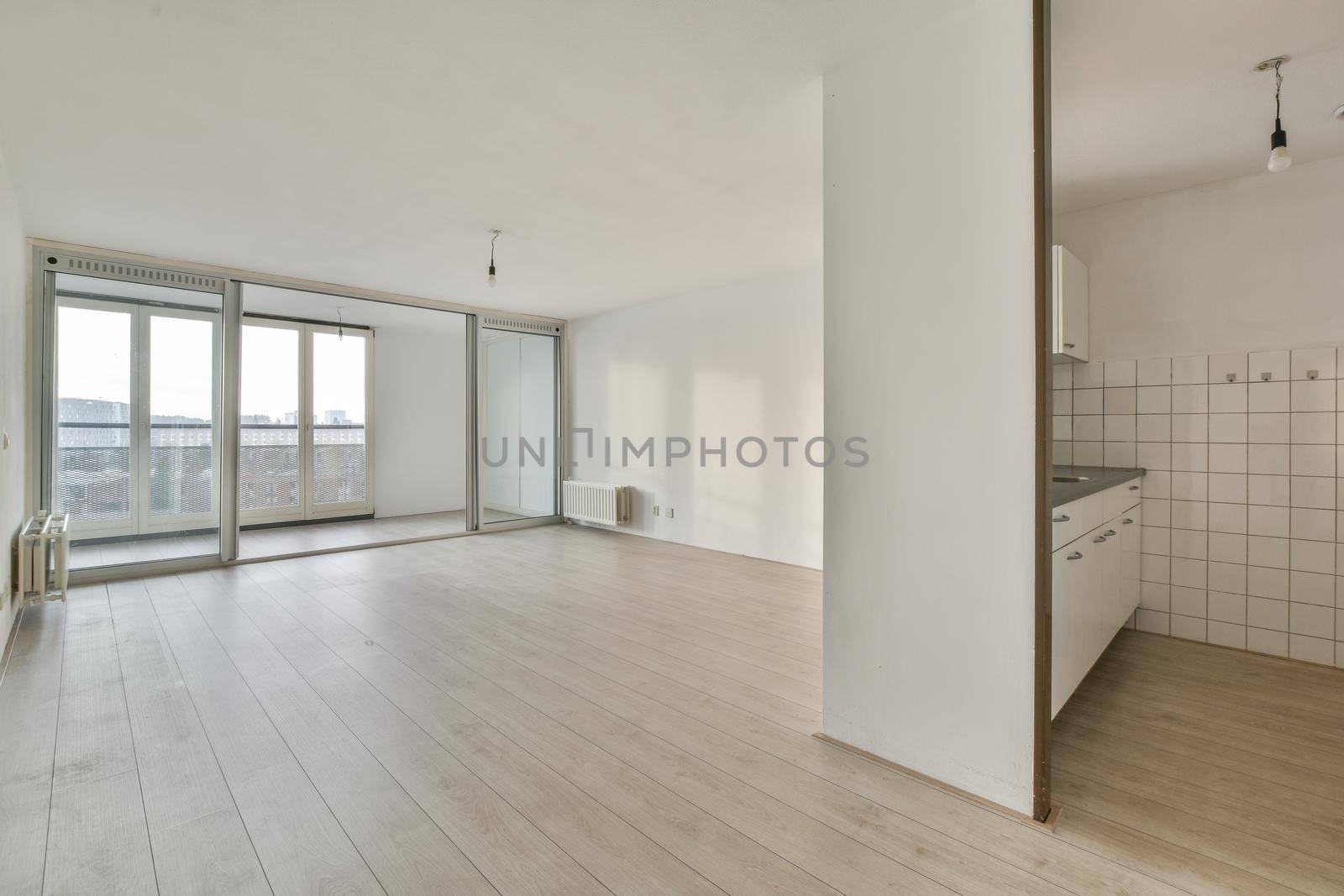 A bright room with large windows on the entire wall
