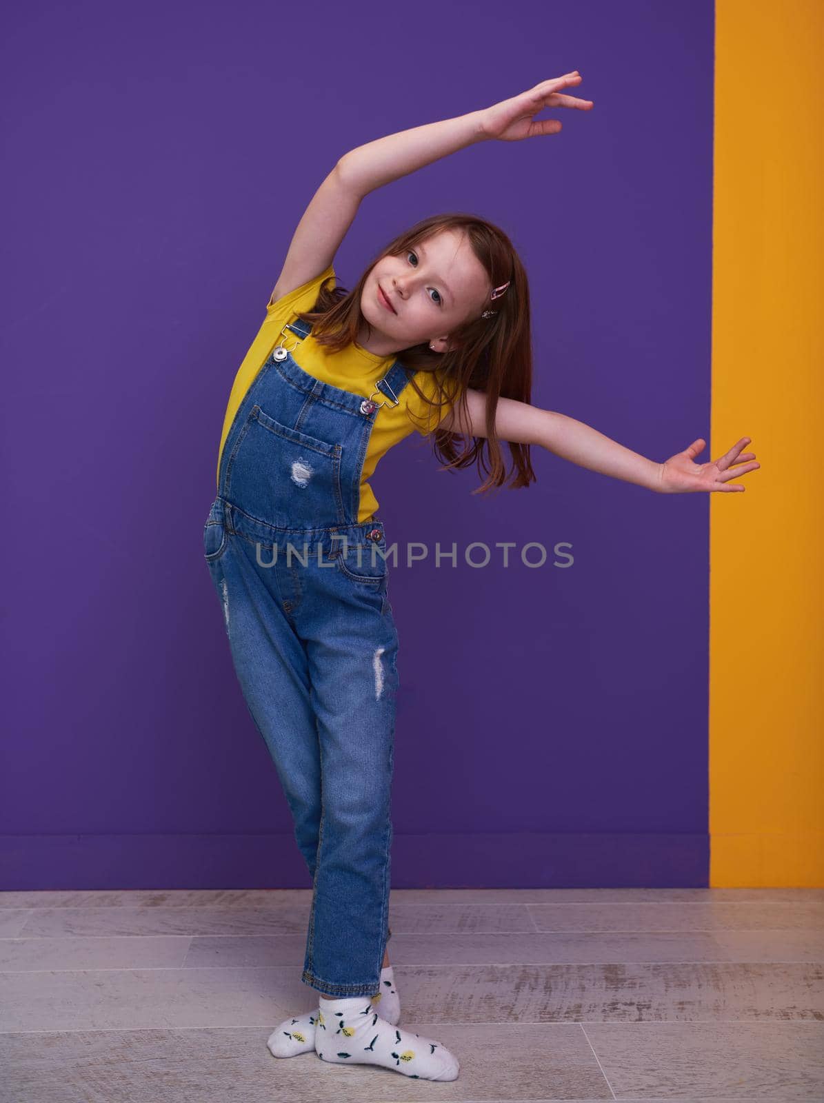 Cute little girl dancing ballet at home
