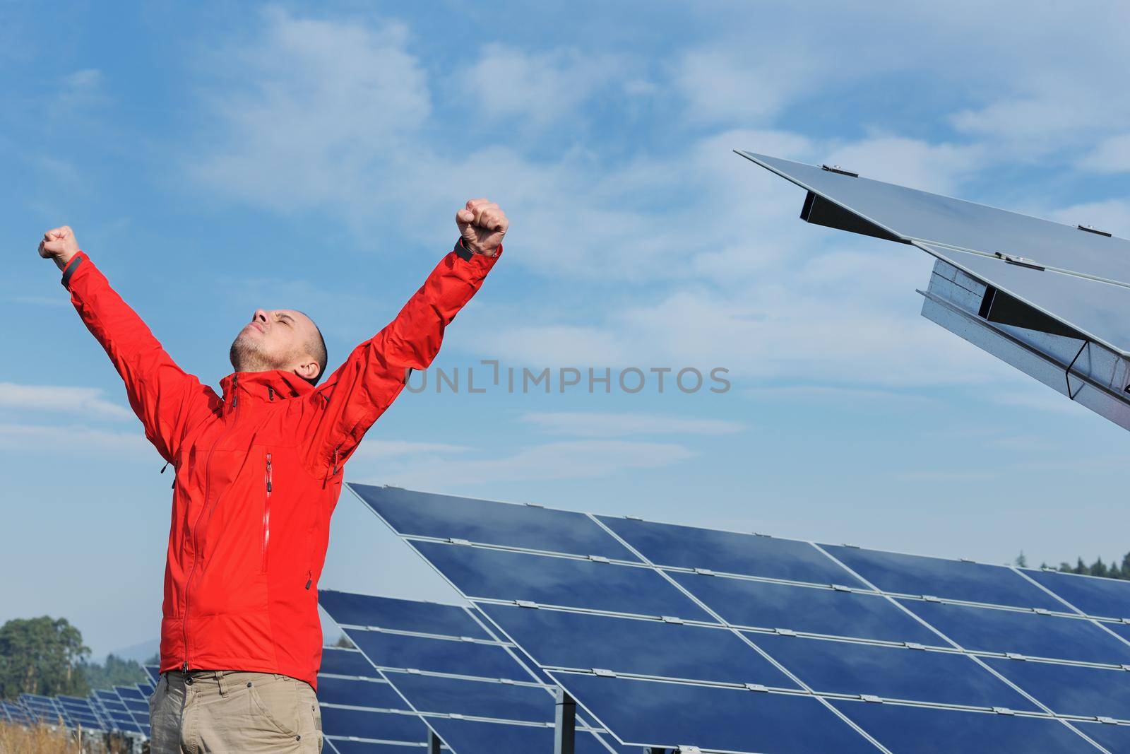 Male solar panel engineer at work place by dotshock