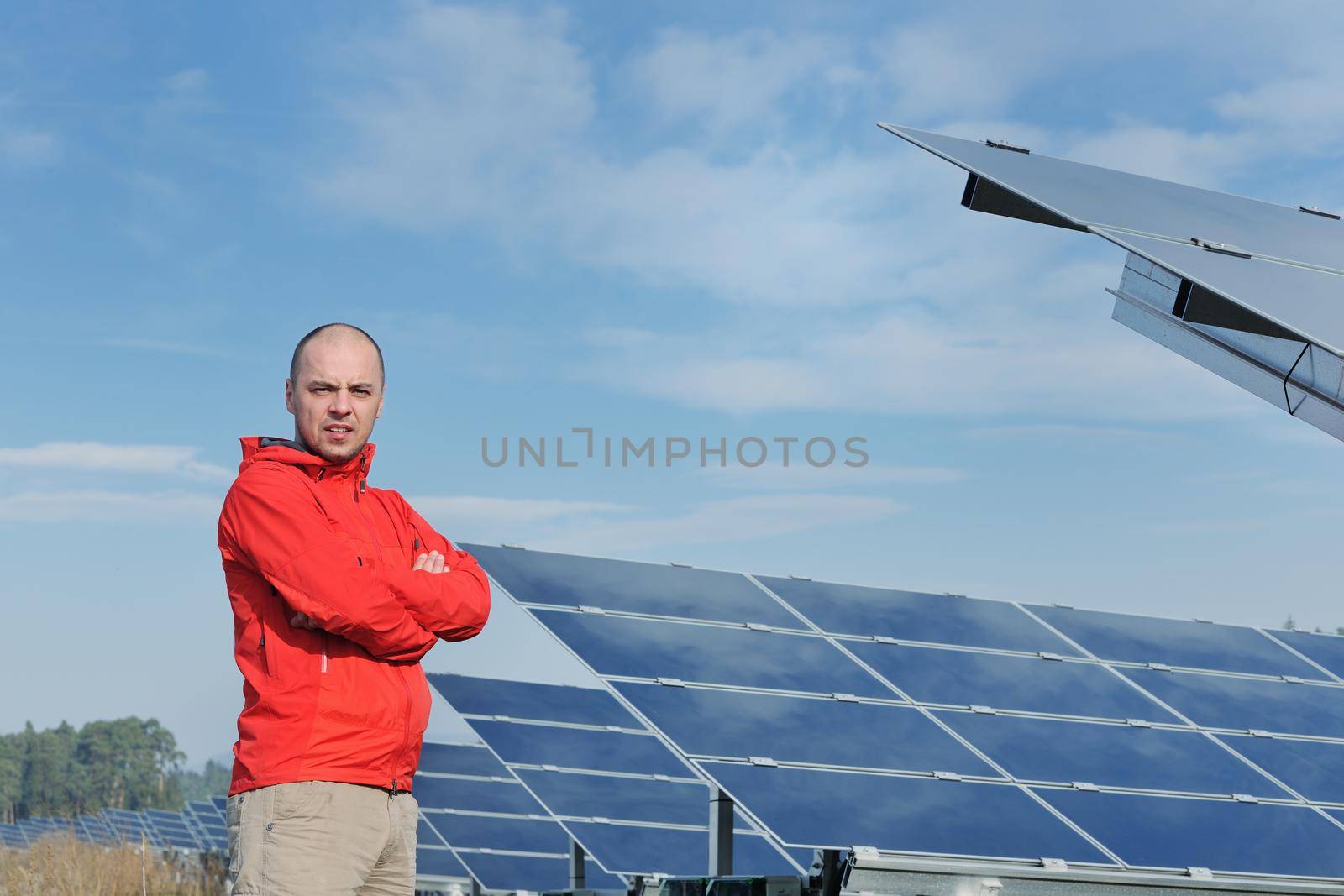 Male solar panel engineer at work place by dotshock