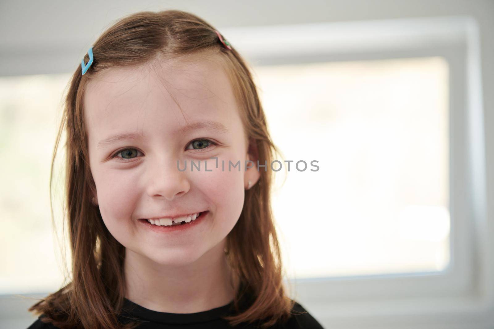 little girl without tooth smiling by dotshock