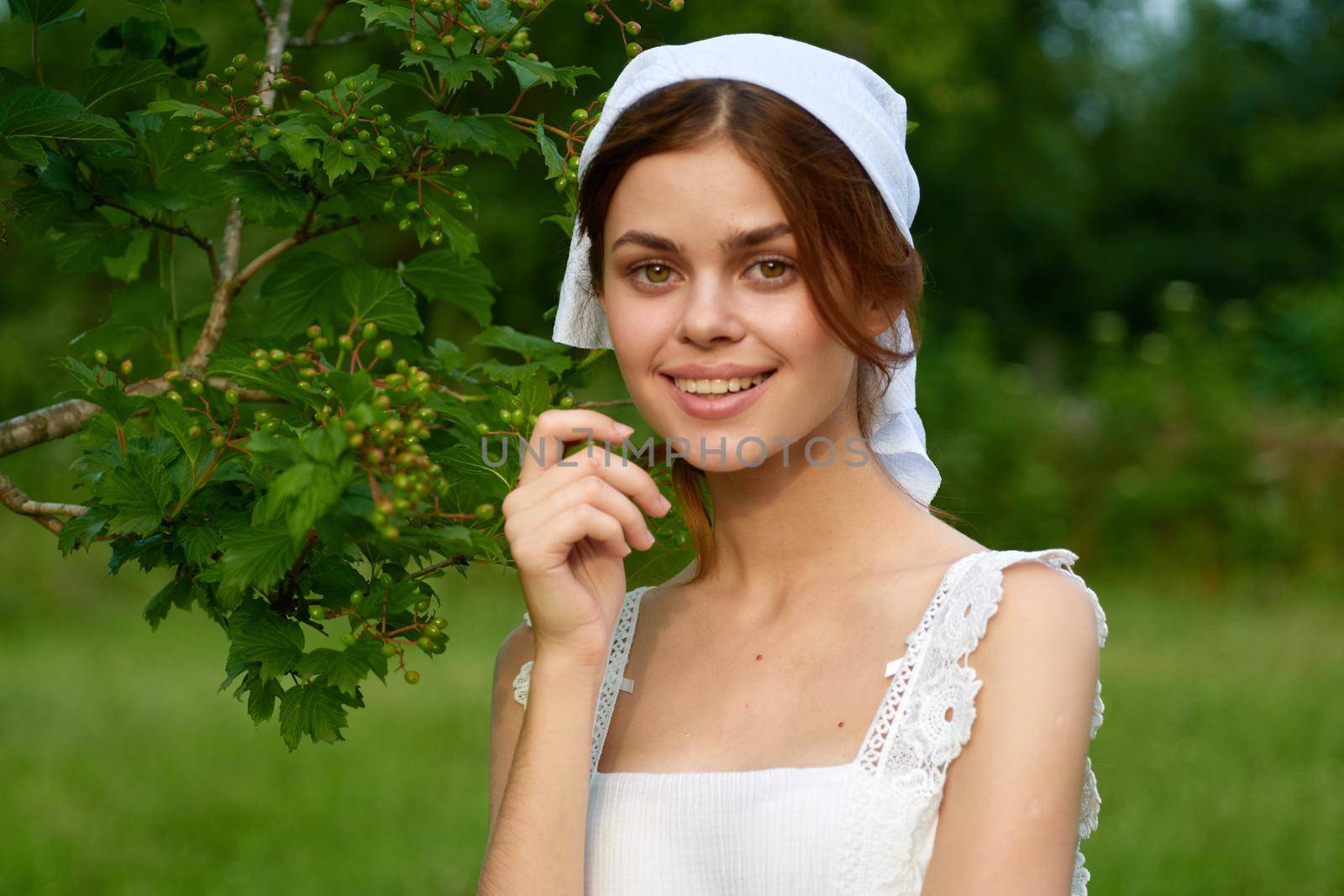 Woman in white dress countryside plants nature. High quality photo