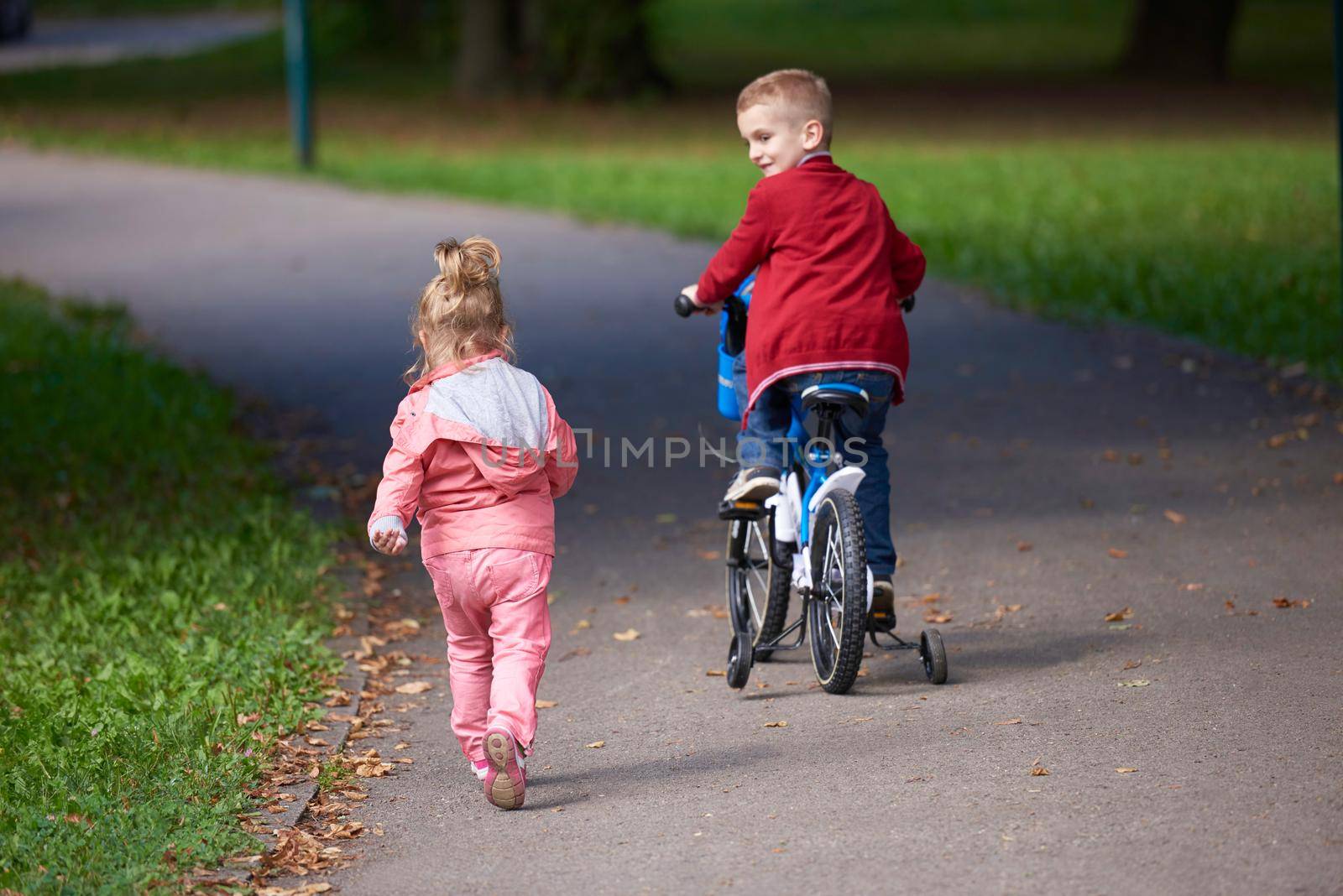 boy and girl with bicycle by dotshock