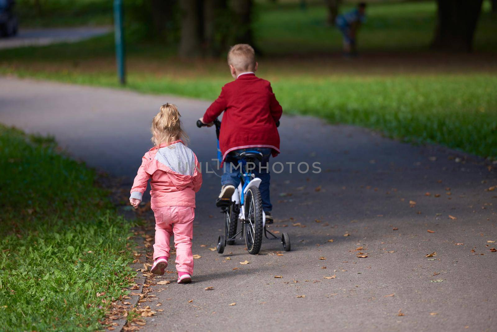 boy and girl with bicycle by dotshock