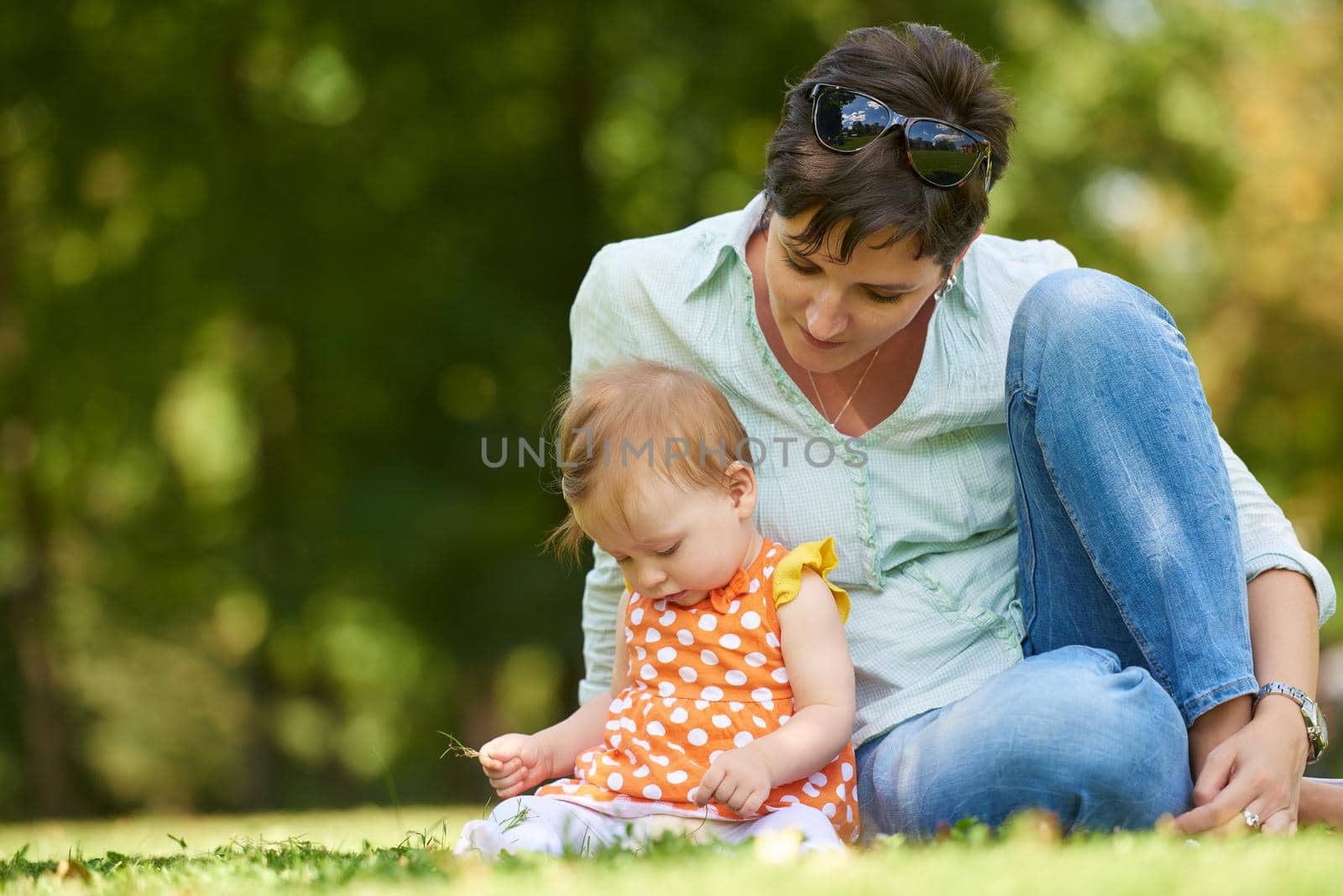 mother and baby in park by dotshock